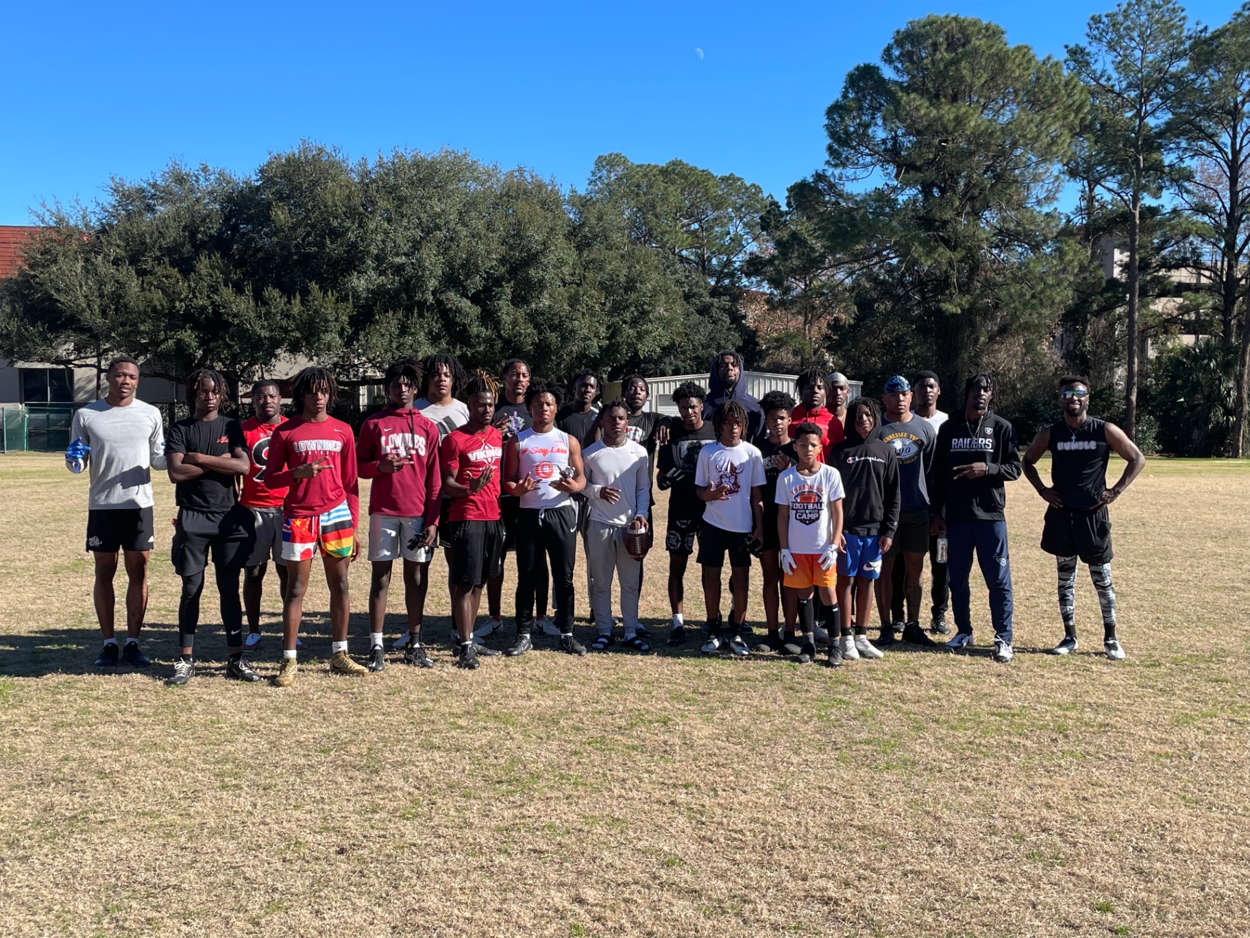 Group of Fit Fighters athletes training on the football field