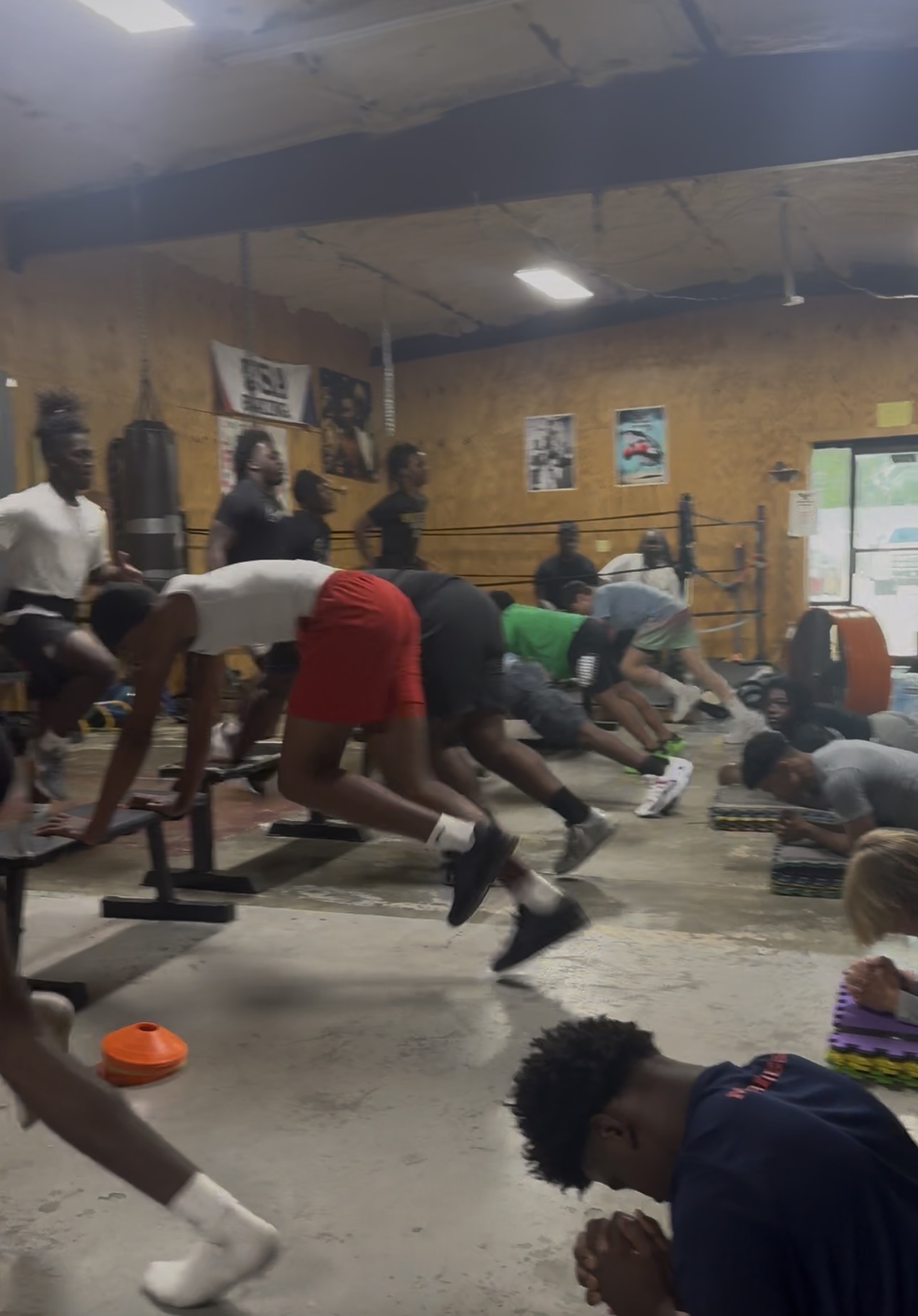 Group of athletes doing explosive plyometric and bench drills