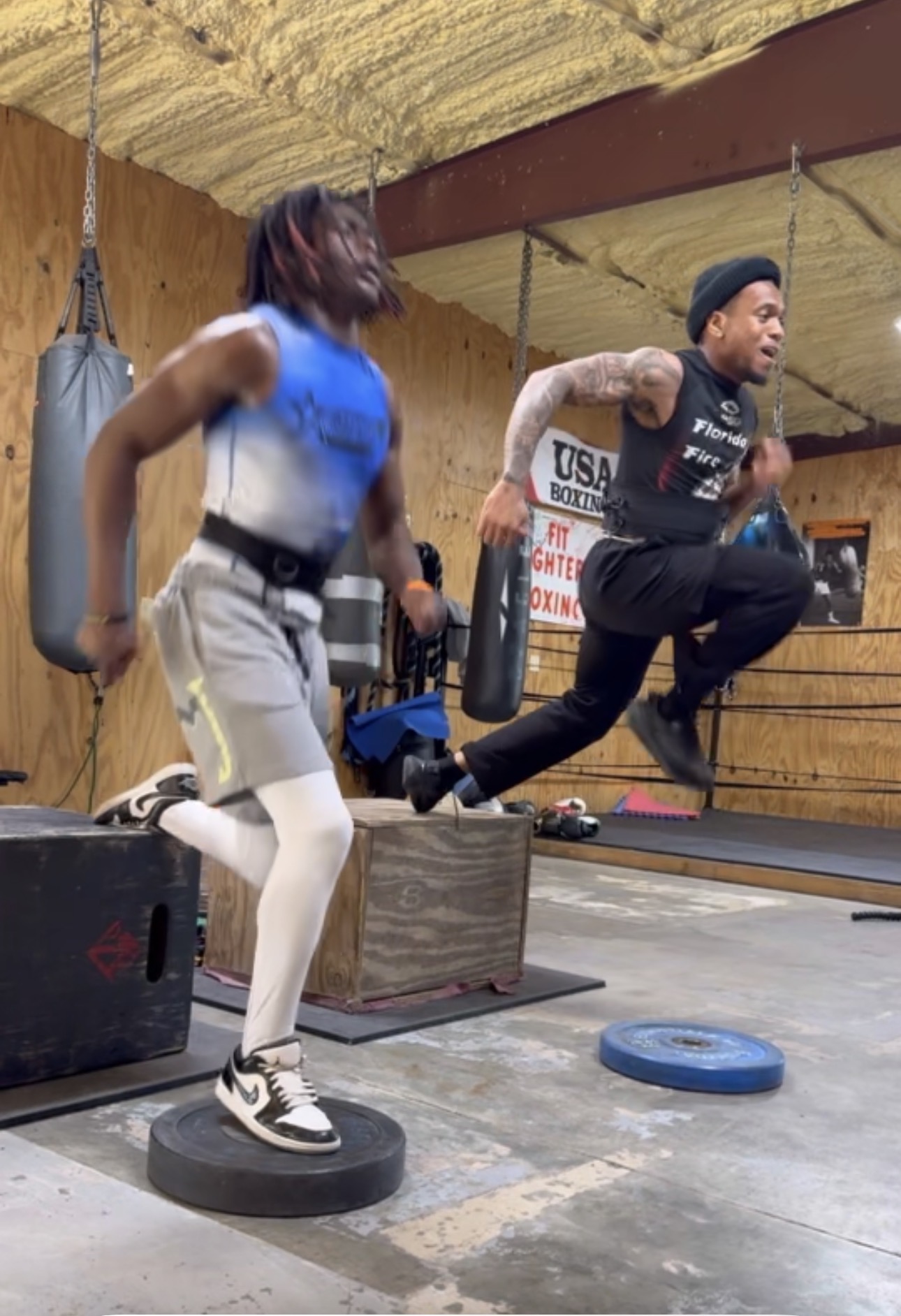 Athletes sprinting resisted with bands during conditioning